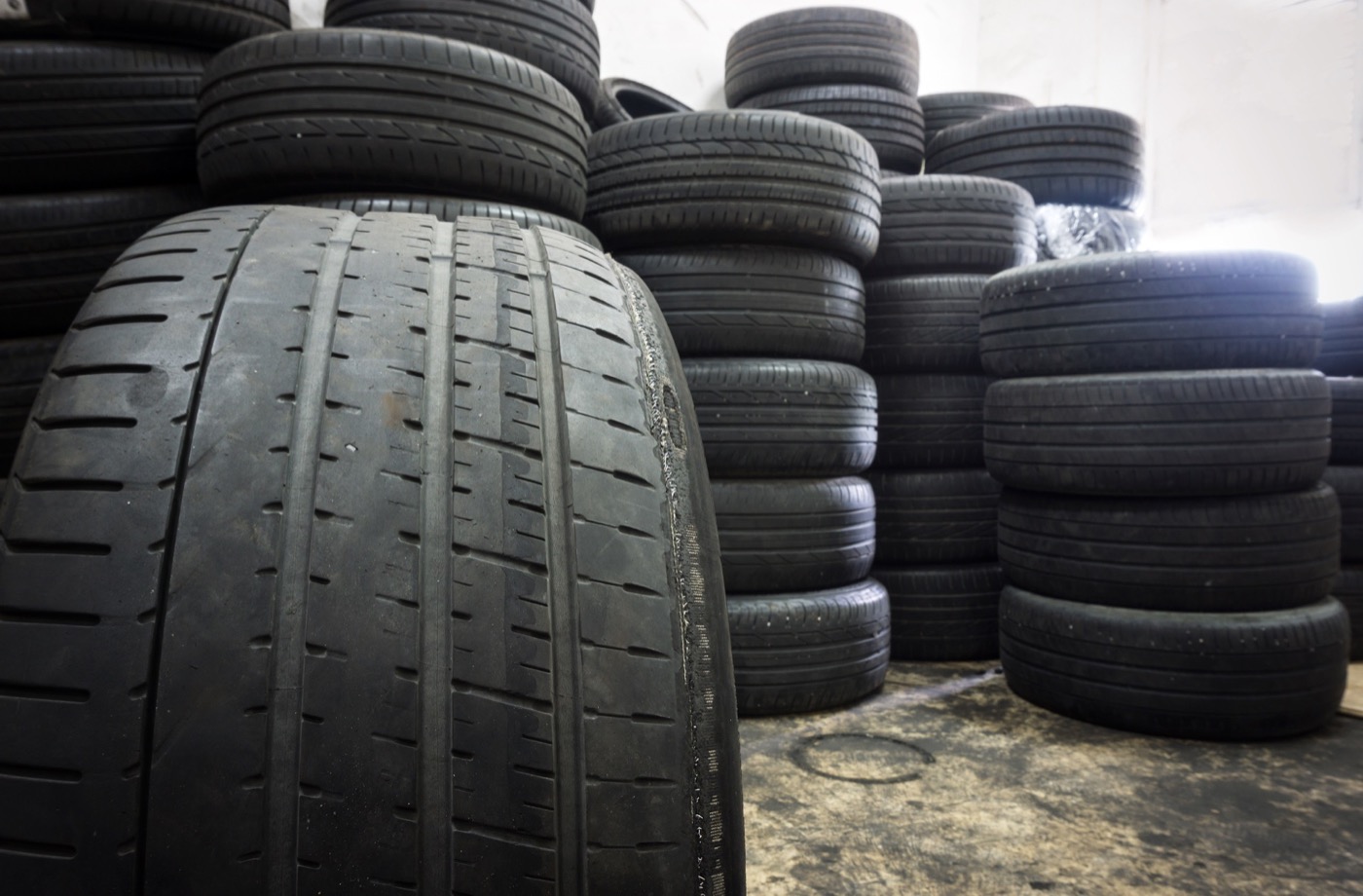 Cracked sidewall on tire in tire lot
